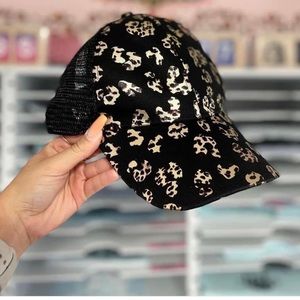 Black cheetah hat with pony tail in the back